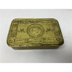 WWI Princess Mary Christmas 1914 brass gift tin containing imitation copies of packets of tobacco, cigarettes and greeting card; together with a WWI oak and steel trench gas rattle marked A. & N.C.S. (Army & Navy Cooperative Society) and broad arrow above '79' above 'G'