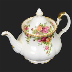 Royal Albert Country Roses tea and dinner service for six place settings, comprising teapot, milk jug, cups and saucers, dessert plates, side plates and dinner plates, all with printed mark beneath 