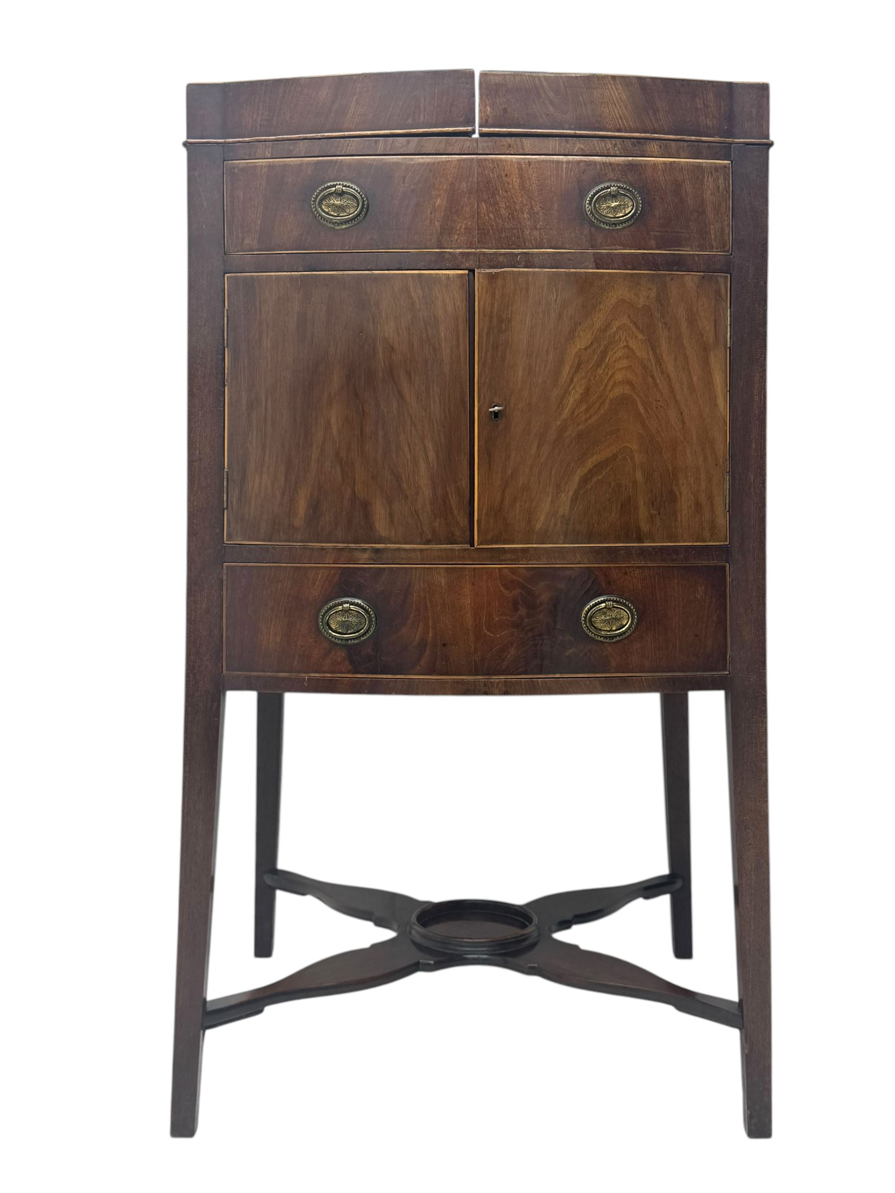 Part canteen of silver plated cutlery, including ivorine handled table and dessert knives, table forks, dessert forks, dessert spoons, teaspoons and soup spoons, all contained within a canteen cabinet converted from a George III mahogany enclosed wash stand