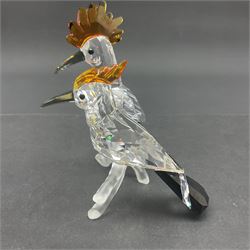 Four Swarovski Crystal bird figures, comprising Cockatoo, pair of Hoopoes on a branch, four Lovebirds on a branch and four Hummingbirds on a branch, largest H10cm
