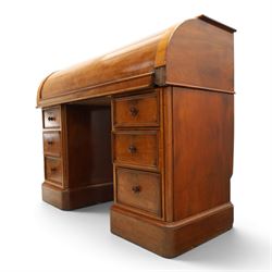 Victorian mahogany twin pedestal cylinder desk, with roll top with fitted interior and with leather writing slide, raised on pedestals with three graduating drawers, raised on a plinth base with castors