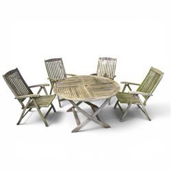 Five piece teak garden dining set, comprising circular folding table and four folding armchairs, with slatted seats and backs in a weathered finish