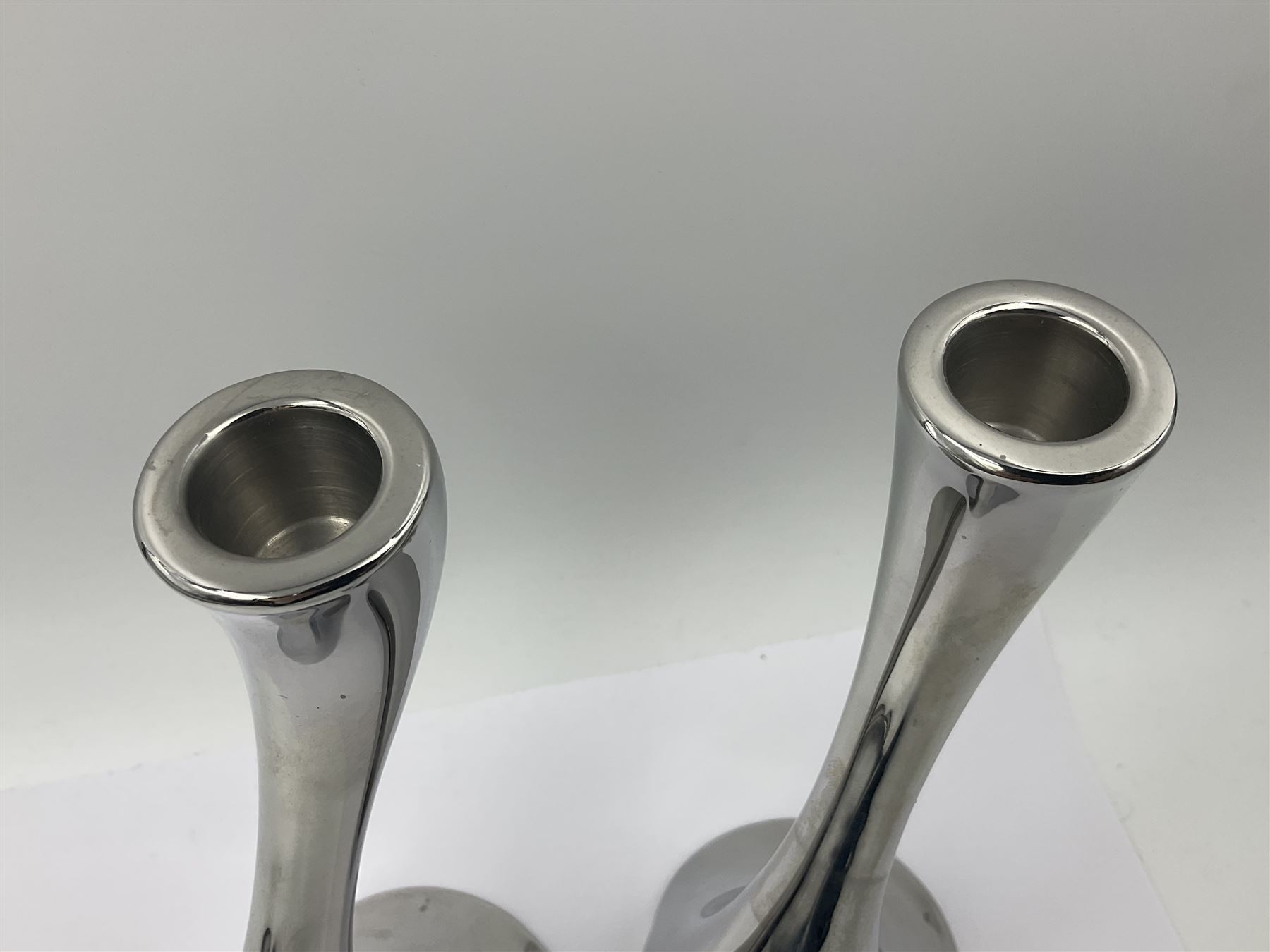 Pair of Georg Jensen chrome 'Cobra' candlesticks, with stamped maker's mark to base, H20cm