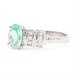 18ct white gold Paraiba tourmaline and diamond ring, single oval cut tourmaline of approx 0.90 carat, with six princess cut diamonds either side, in a stepped design setting, hallmarked, total diamond weight approx 0.35 carat