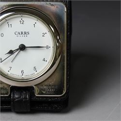 Silver mounted glass decanter, boxed with wooden plinth, together with a silver pepper grinder and a silver mounted Carrs desk clock, all hallmarked