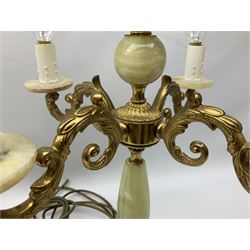  20th century gilt metal and onyx four branched candelabra upon a circular base, and onyx table lamp in the form of an urn, tallest example H48cm