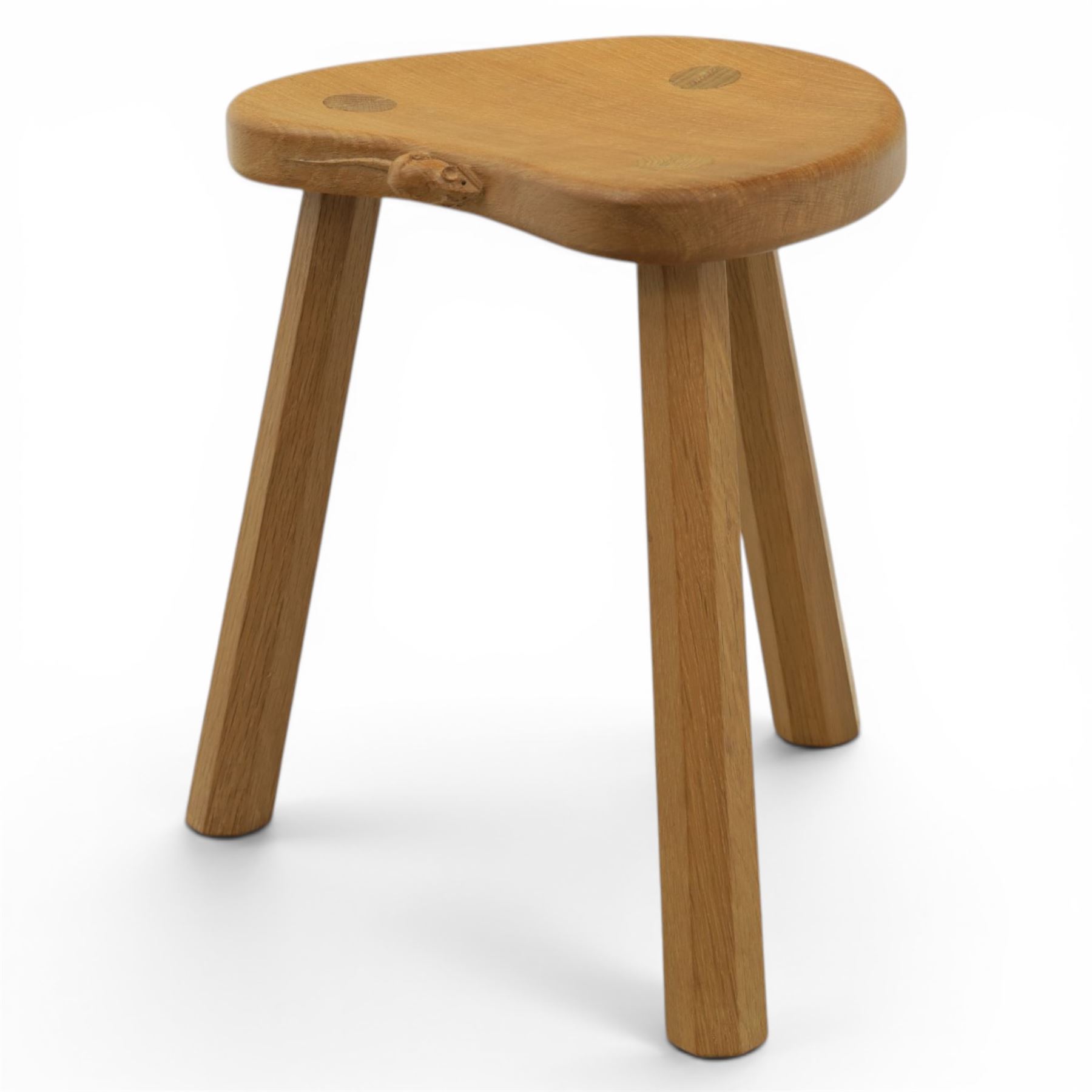 Mouseman - oak three legged calf stool, with carved mouse signature, by the workshop of Robert Thompson of Kilburn