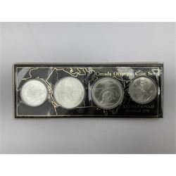 Canadian coinage including Queen Elizabeth II 1964 and four 1966 dollars, 1975 Olympic four coin set comprising two five dollar and two ten dollar coins, 1995 specimen coin set in blue folder, 1995 uncirculated coin set etc 