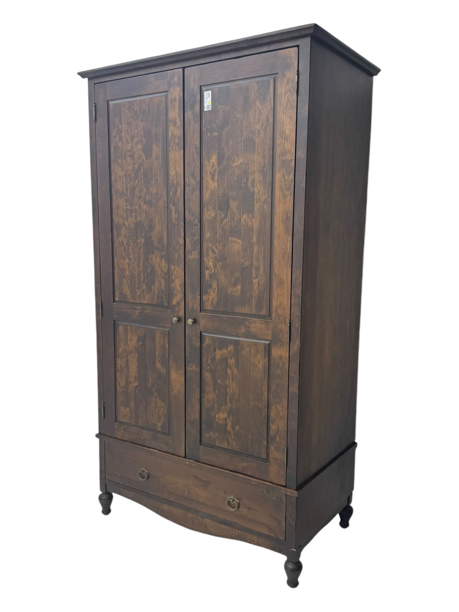 Marks & Spencer - dark wood double wardrobe, fitted with single drawer, on turned feet