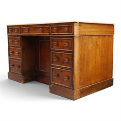 Victorian mahogany kneehole desk, rectangular top fitted with central frieze drawer over recessed cupboard, flanked by four graduating drawers to each side, on skirted base