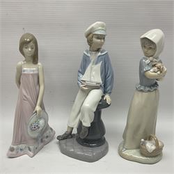 Three Lladro figures comprising Rabbit no 5904, Sarah no 5647 and Boy with Boat together with three other figures 