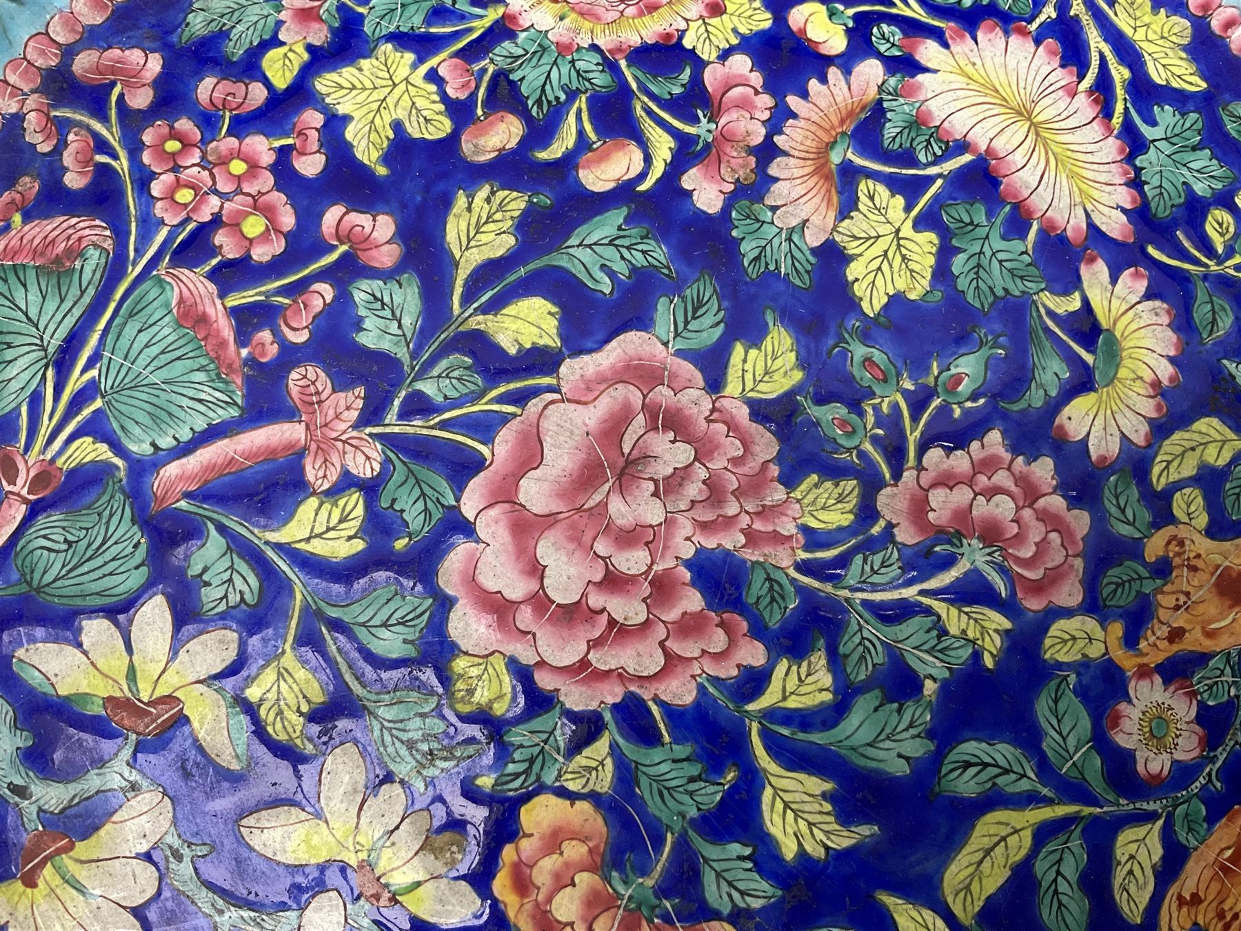 18th/19th century Chinese Canton enamel basin, the circular basin with flat everted rim, decorated with scrolling foliate and fruit decoration on a blue ground, D43cm