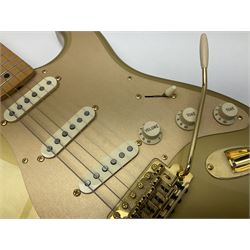 Fender Stratocaster 50th Anniversary 2004 metallic gold electric guitar; serial no.MZ4116369; L98cm; in Spider fitted case with owners manual and other paperwork, strap and belt buckle etc