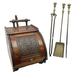 Victorian mahogany coal scuttle, the domed rolling lid carved with ornate foliate motifs opening to reveal interior with twin handled liner, mounted with carrying handle and shovel, together with brass fireside tools, largest H46cm