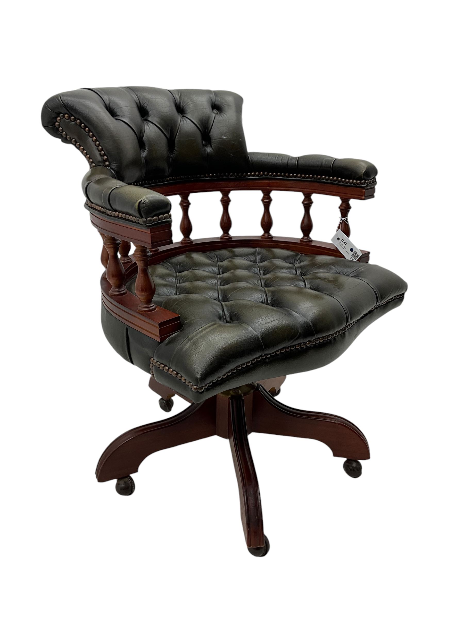 Captain's swivel desk chair, upholstered in studded green leather