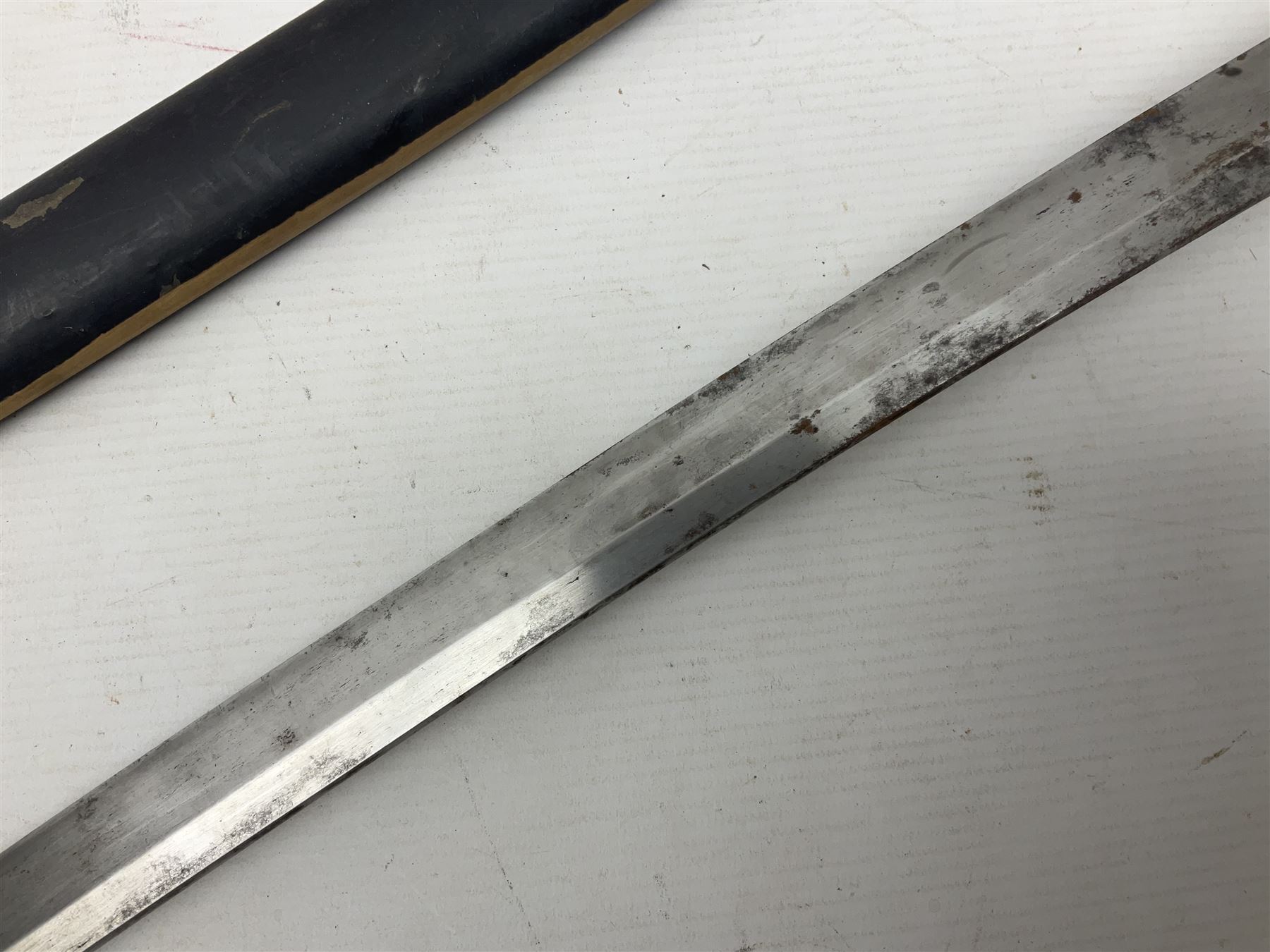 Good quality Japanese sword blade with later WWII fittings and scabbard  - 67.5cm slightly curving blade with unmarked tang, plain iron tsuba and lacquered grip with copper mounts; in lacquered wooden scabbard with tape bound tip L94cm overall