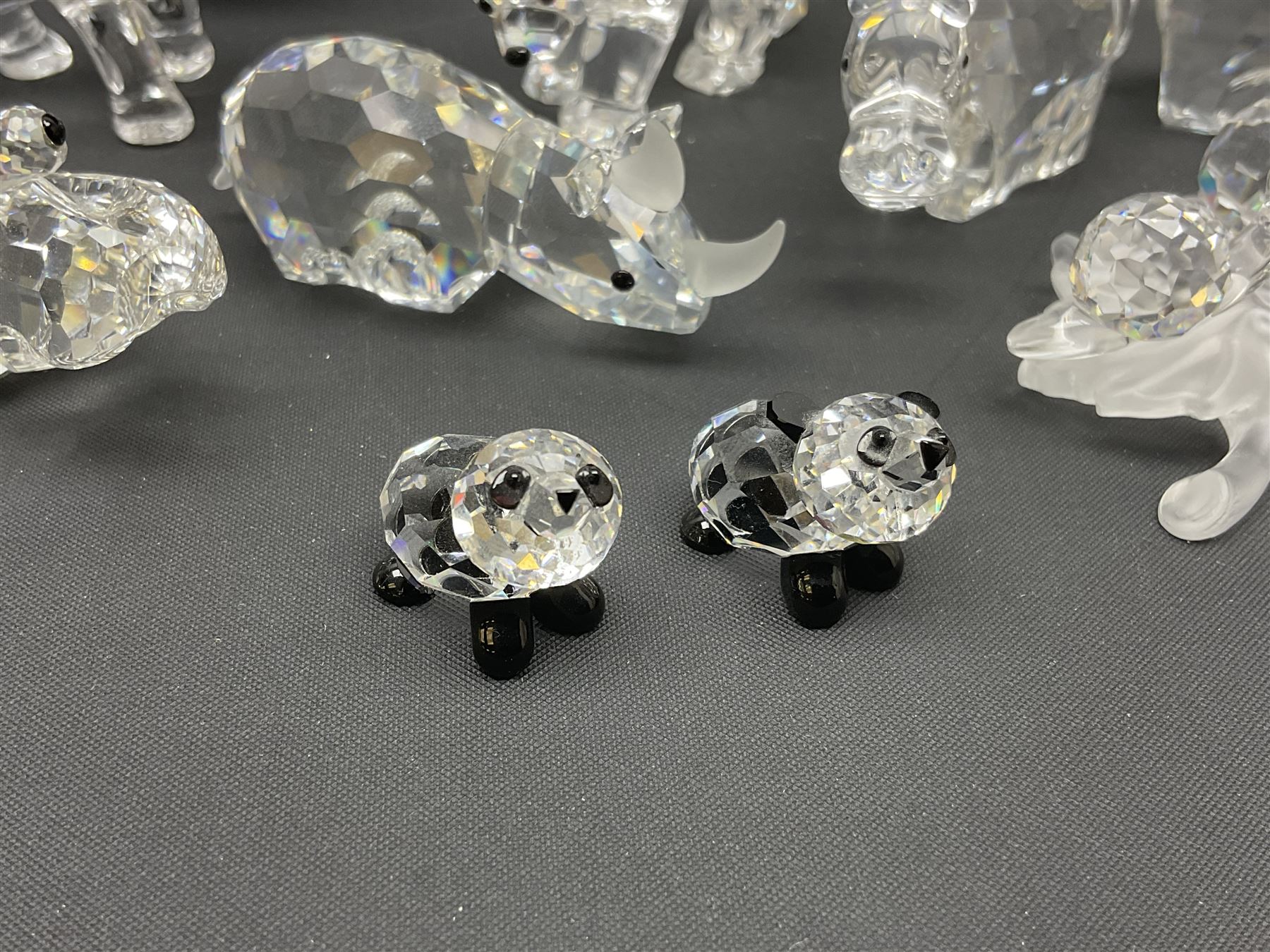 Twenty nine Swarovski Crystal animals, to include koala and baby, in frosted tree branch, elephants, polar bears, squirrel, monkeys, panda, unicorn and snails, etc 