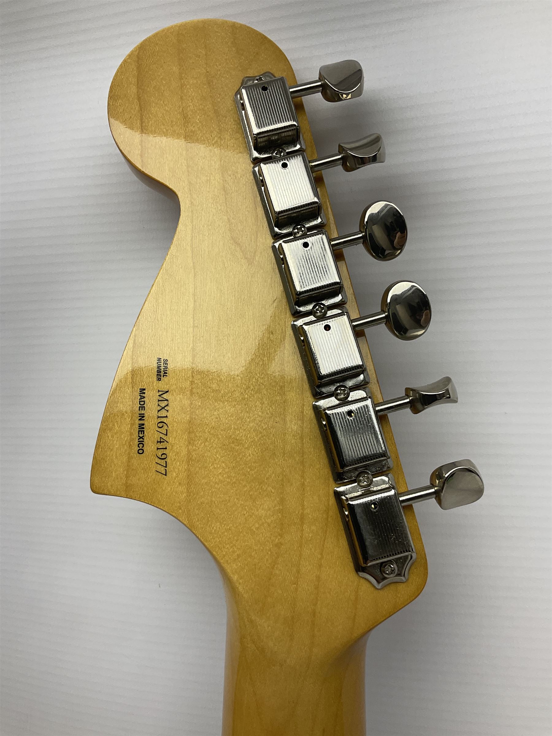 Mexican Fender Jaguar electric guitar with Humbucker pick-ups and tremolo arm, serial no.MX16741977, L101cm; in soft carrying case