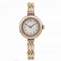 Early 20th century 9ct gold manual wind wristwatch, silvered engine turned dial with Arabi...