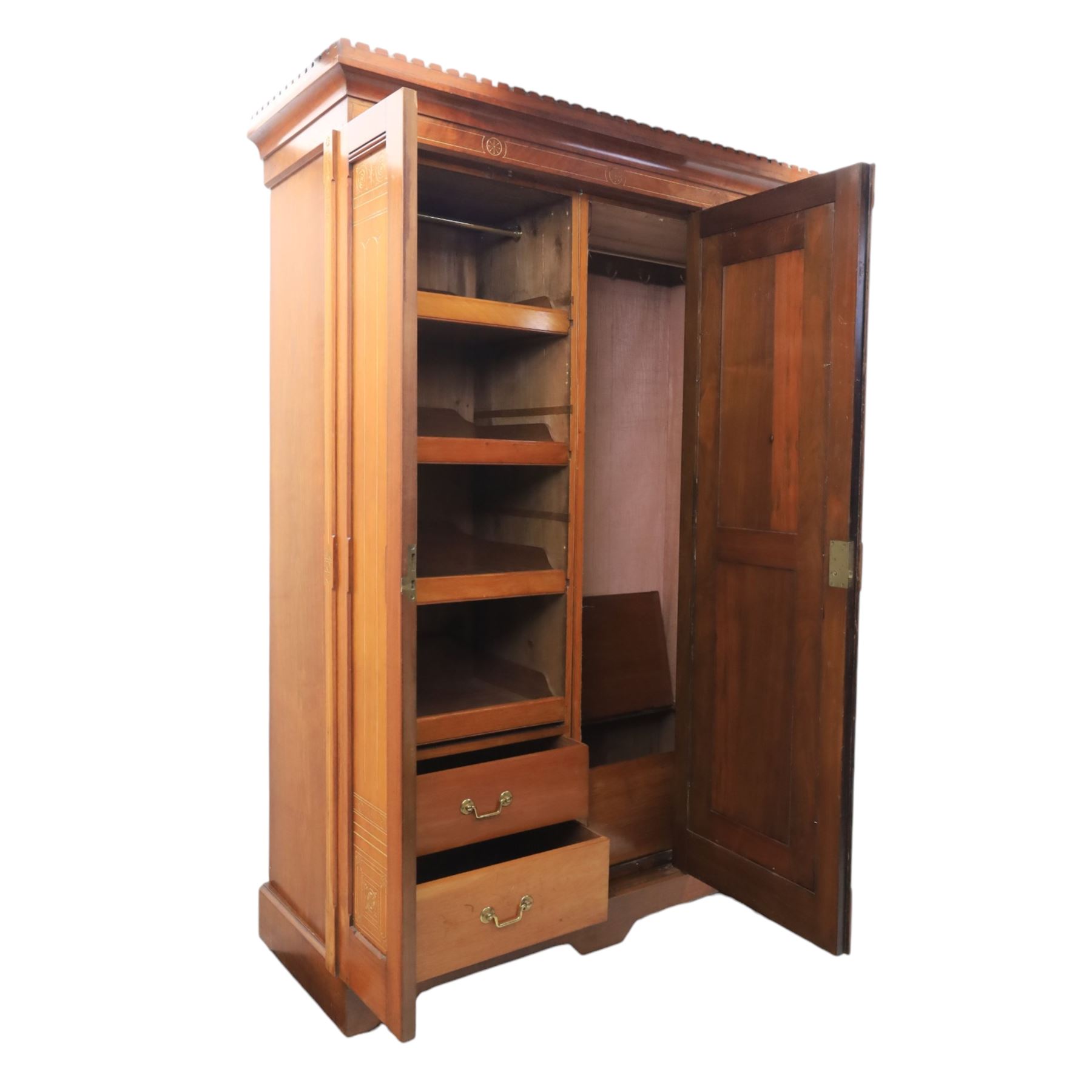Aesthetic Movement walnut parcel gilt wardrobe, the crenellated top, above central mirrored door opening to reveal hanging space, four opened and two closed draws