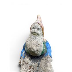 Early large scale composite stone garden gnome, original distressed paint