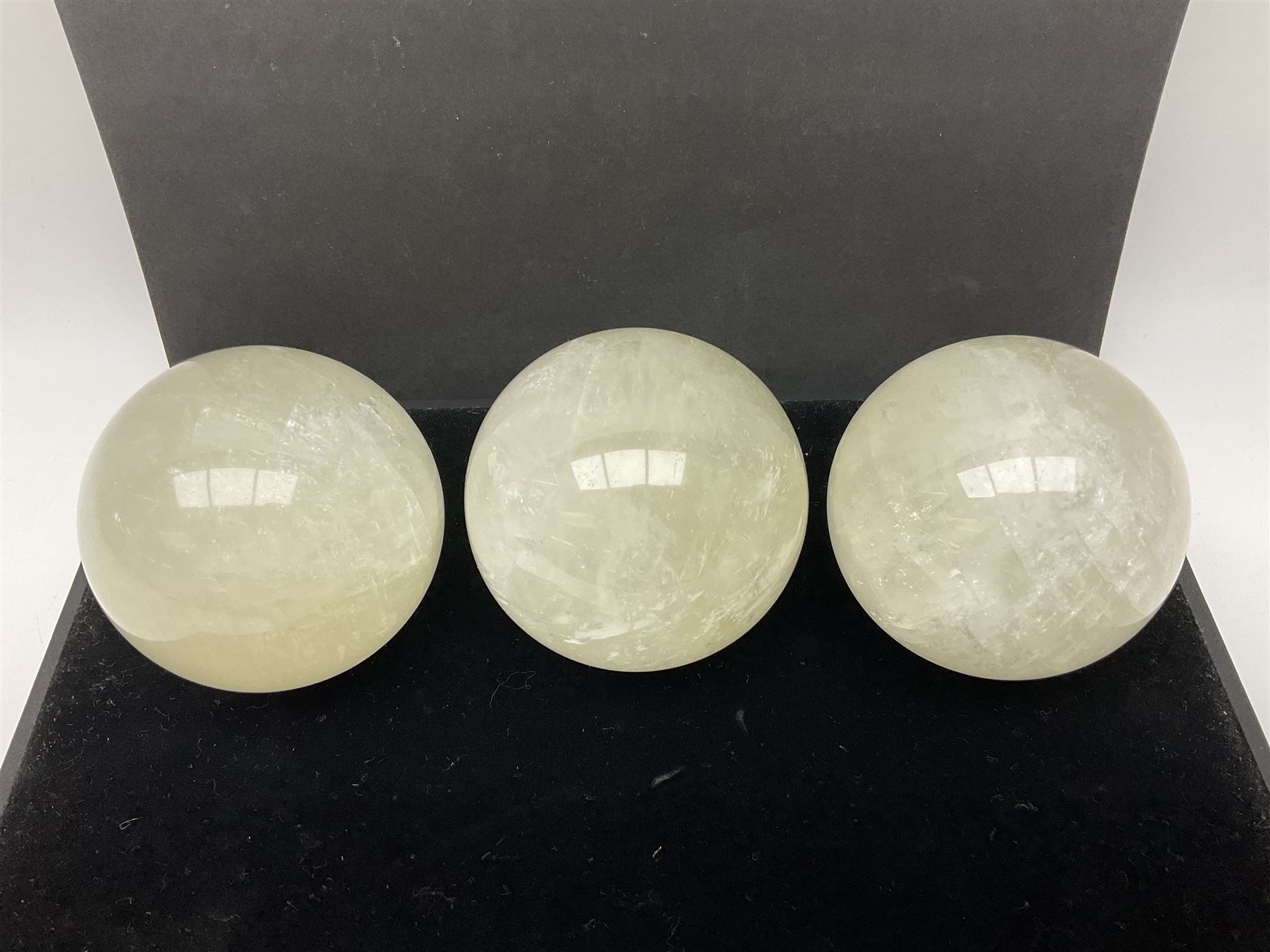 Set of three clear calcite spheres, D8cm
