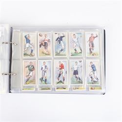 Collection of Edwardian and later Football related trading and cigarette cards, including forty-nine of fifty 1906 Ogden's Football Club Colours, 1922 PALS Footall series, ninety of one hundred 1925 Gallaher Famous Footballers, complete set of forty-four 1926 Ogden's Captains of Association Football Clubs and Colours, complete set of fifty 1927 Players Football Caricatures by MAC,  complete set of fifty 1927 Players Football Caricatures by RIP,  complete set of fifty 1930 Players Association Cup Winners, complete set of 50 1933 Ogdens AFC Nicknames etc, housed in brown cigarette card album