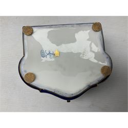 Sevres style late 19th/early 20th century trinket box decorated in the rococo style, the shaped cover painted with an 18th century courting couple in a garden scene opening to reveal the interior painted with floral sprays, the conforming body with a painted panel of floral decoration, all reserved upon cobalt blue ground with foliate gilt borders, with interlaced L's mark beneath, L12cm H6cm