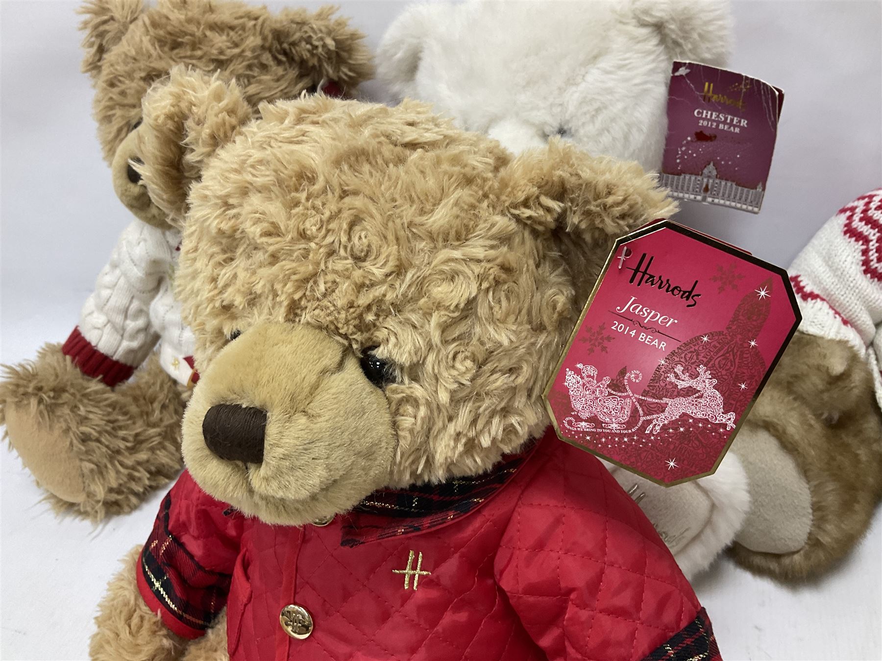 Six Harrods annual teddy bears, dating between 2011 and 2016, tallest H38cm