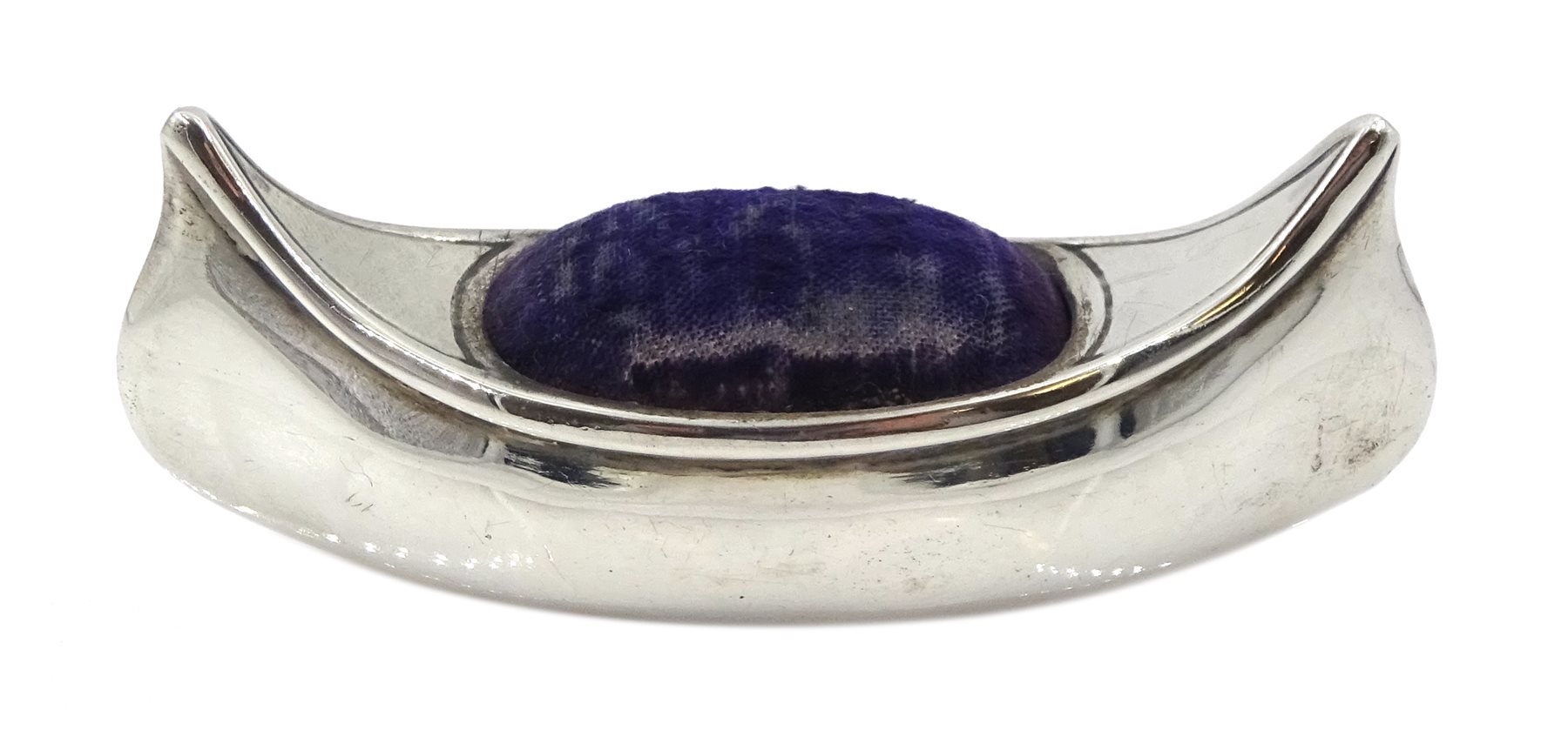 Edwardian silver pin cushion, in the form of a canoe by Cornelius Desormeaux Saunders & James Francis Hollings (Frank) Shepherd, Birmingham 1904