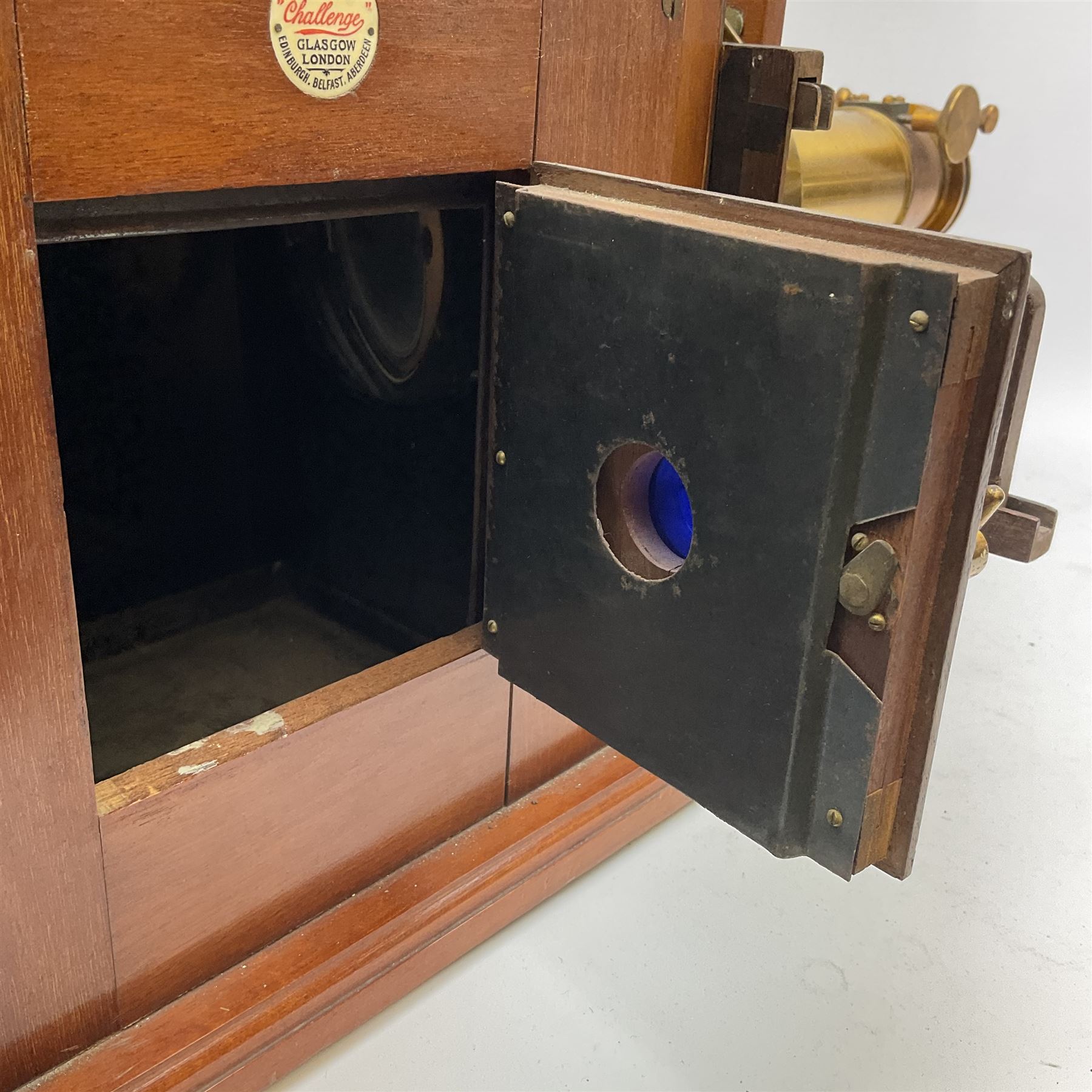 Victorian brass and mahogany 'Model C Challenge' magic lantern projector by J. Lizars, with long and short lenses, bears inset maker's plaque, L50cm excluding lenses (lacking burner)
