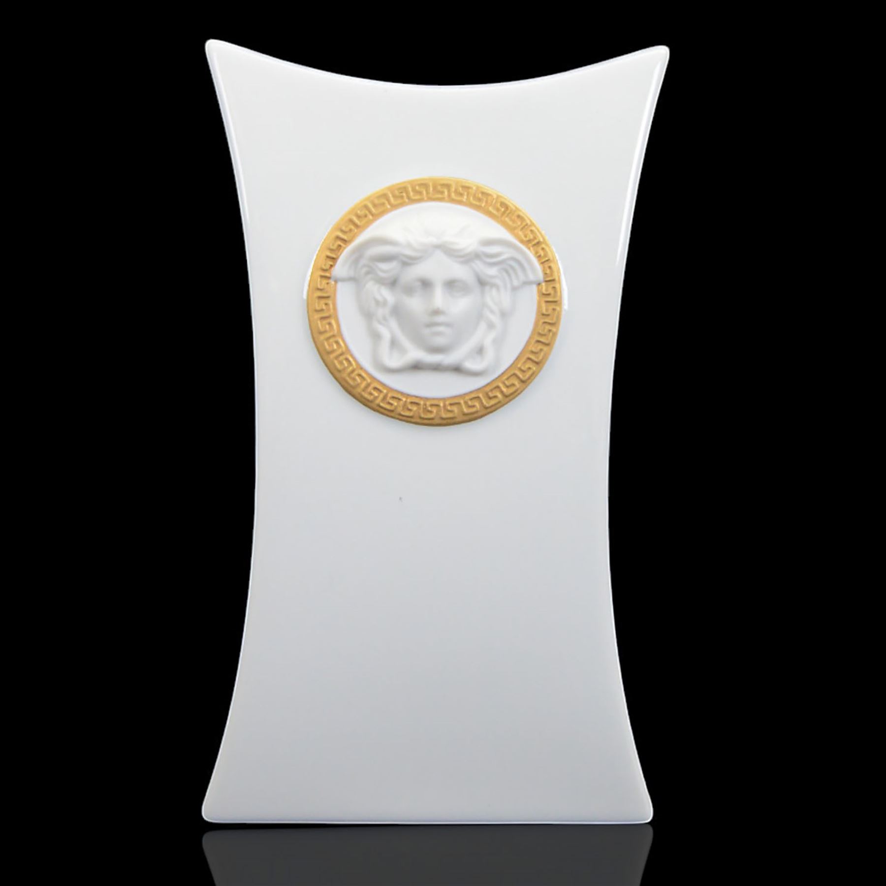 Rosenthal Versace Gorgona vase, of concave form, decorated in relief with medusa masks and gilt greek key borders upon a white ground, boxed, H17cm
