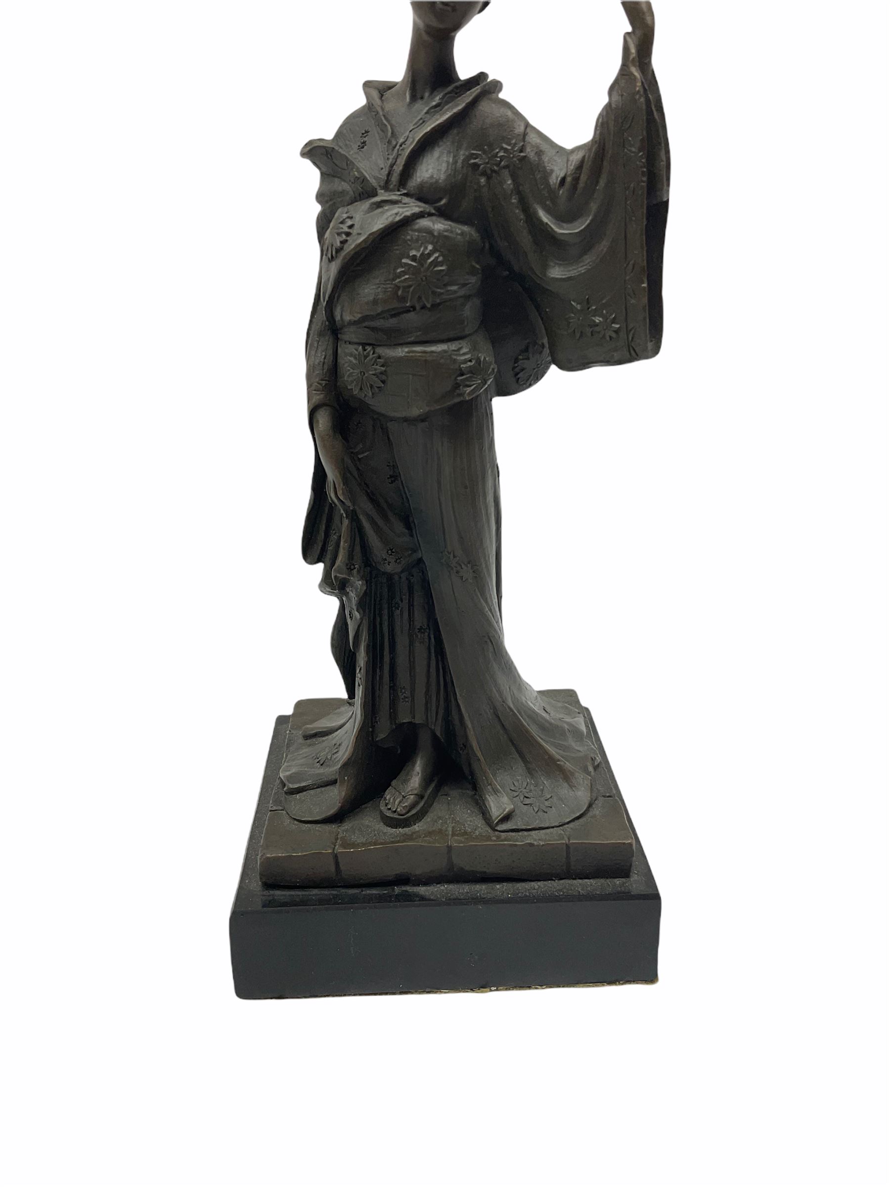 A Japanese bronze modelled of a Geisha, impressed Kamiko, upon slate base, H25cm. 