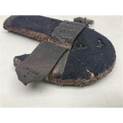 Eastern Jambiya, the 19cm double edge steel blade with raised medial ridge, waisted horn grip with pique work and white metal band; in stitched leather scabbard L33cm overall
