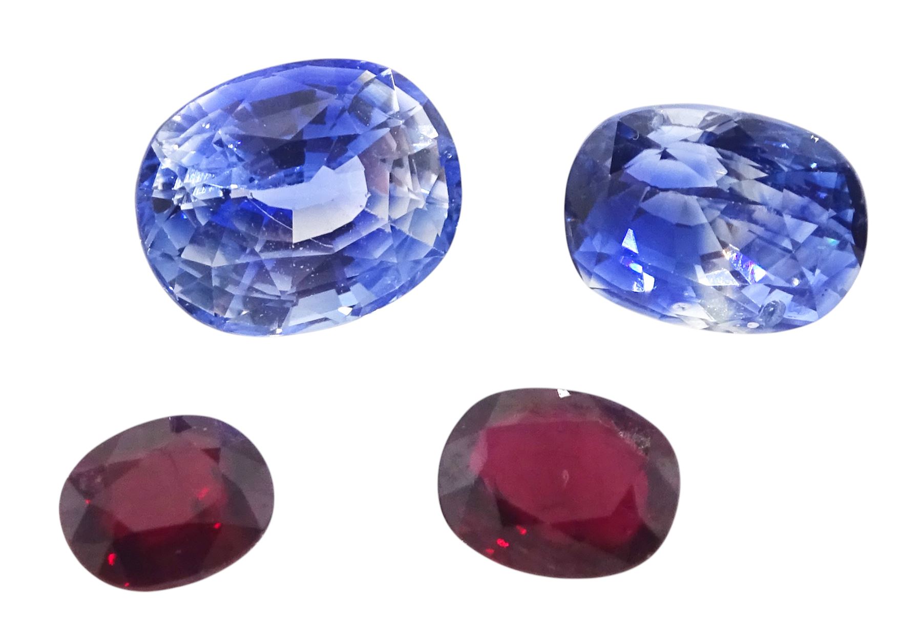 Two loose sapphires and two loose rubies, each ruby 0.58 carat and 0.82 carat