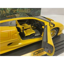 Two Maisto 1:12 scale Jaguar XJ220 ‘Racing’ cars in yellow, both on plinths in original boxes 