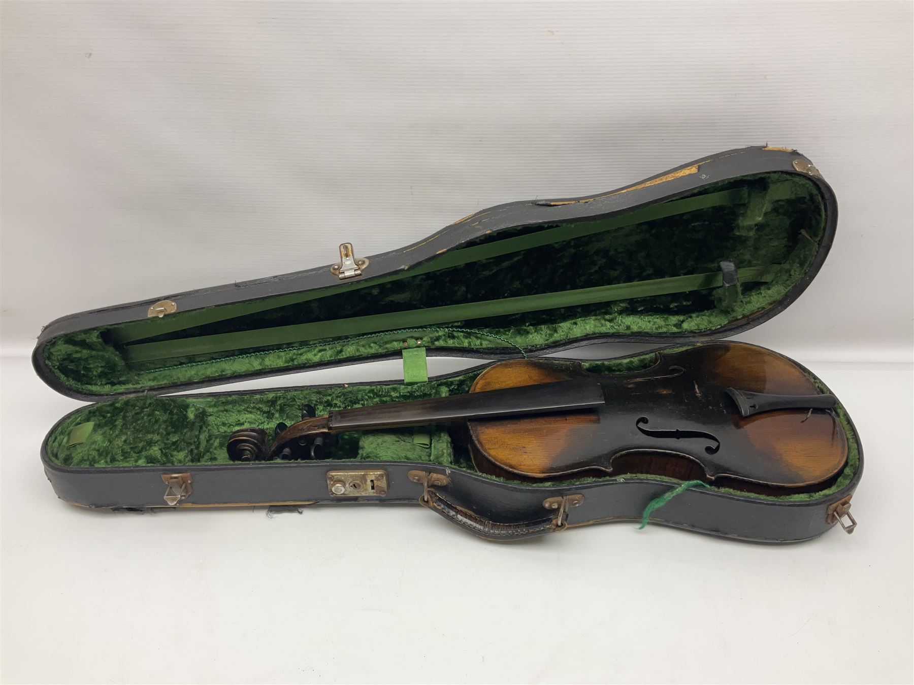 German violin c1890 with 36cm two-piece maple back and ribs and spruce top; bears label 'Antonius Stradivarius Cremona Faciebat Anno 1729' L59.5cm overall; in ebonised wooden 'coffin' case; and two German violins c1890 for completion - one bearing a Stradivarius label, the other a Ruggeri label; both in carrying cases (3)