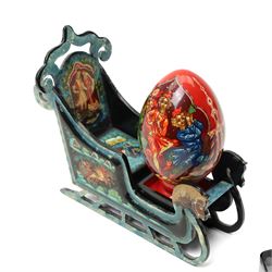 Modern  Russian lacquer box decorated with a Winter landscape, another in the form of a Troika, another lacquer box and a lacquer egg.