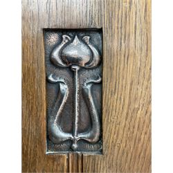 Art Nouveau oak wardrobe with copper panels, single mirror door enclosing hooks