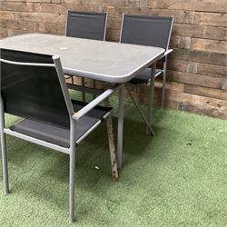 Rectangular metal framed garden table with glass top and four stackable chairs - THIS LOT IS TO BE COLLECTED BY APPOINTMENT FROM DUGGLEBY STORAGE, GREAT HILL, EASTFIELD, SCARBOROUGH, YO11 3TX