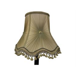 Early 20th century floor lamp, with fringed and pleated silk shade over a carved and turned column, on a circular stepped base