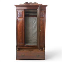 Edwardian walnut wardrobe, featuring single sectional mirror door with bevelled panes, single drawer to base