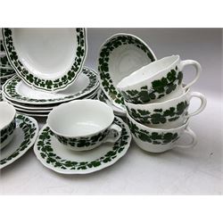 Meissen part tea service, with vine leaf decoration on a white ground, comprising thirteen teacups in two styles, five saucers and five dessert plates, (23)