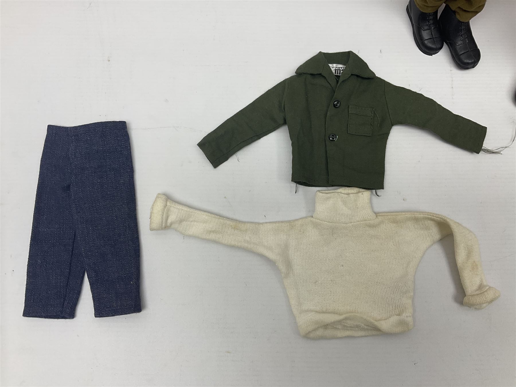 Palitoy Action Man Action Soldier No.34014 with tunic, belt, trousers, boots, blue beret and sten gun; in original box; and Palitoy Action Man Royal Military Policeman (RMP) gripping hands figure, marked 'Made in England by Palitoy under licence from Hasbro © 1964' to rear of torso; with tunic, shirt, trousers, tie, boots, belt, truncheon, pistol in holster, MP armband, red cap, Sterling machine gun and other clothing etc; in anrelated display box (2)