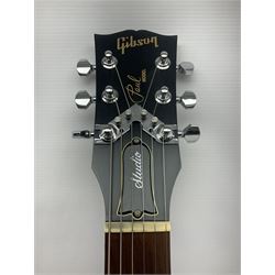 2012 American Gibson Les Paul Studio electric guitar, retro fitted with iron gear pick-ups, push-pull 'pots', roller bridge, string butler and locking machines, serial no.115321594, L99cm overall; in Gibson soft carrying case.