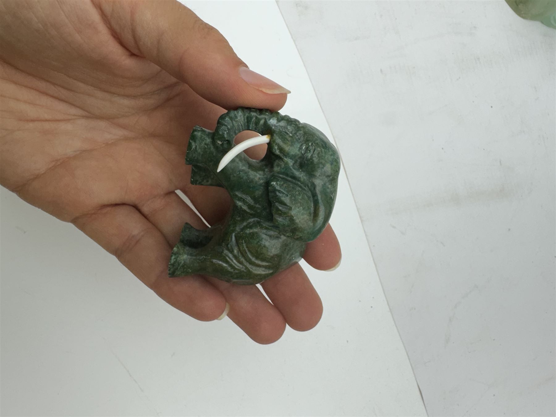 Collection of carved stone animals including  Lapis Lazuli armadillo, Malecite rhino, Amber dog etc  