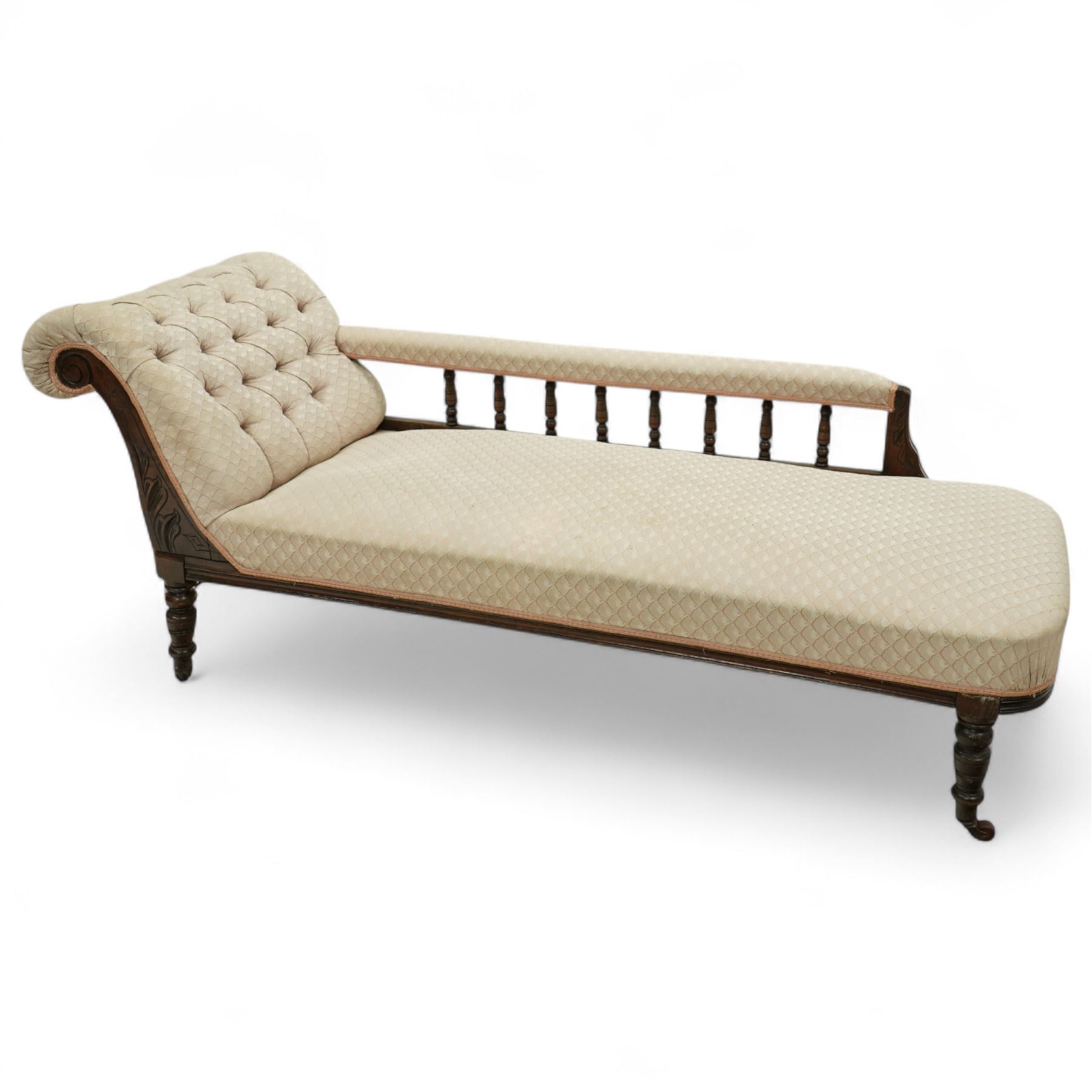 Late 19th century cream upholstered chaise longue, patterned pale damask fabric, padded arm with spindle back gallery raised on turned legs upon castors