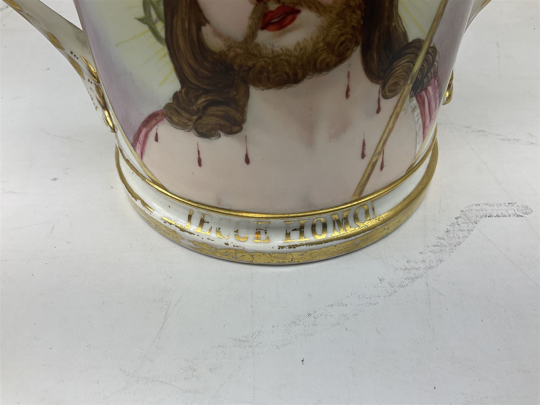19th century loving cup, with decorated with religious iconography, a gilt rim and writing 'Henry Whittirld Wolverhampton, Whoever drinketh of the water shall thirst again but who soever drinketh of the water that i shall give him shall never thirst',  H14cm