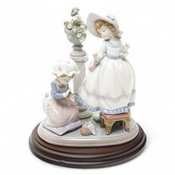 Lladro 'A Stitch in Time' figural group on hardwood stand, model no 5344, H32cm