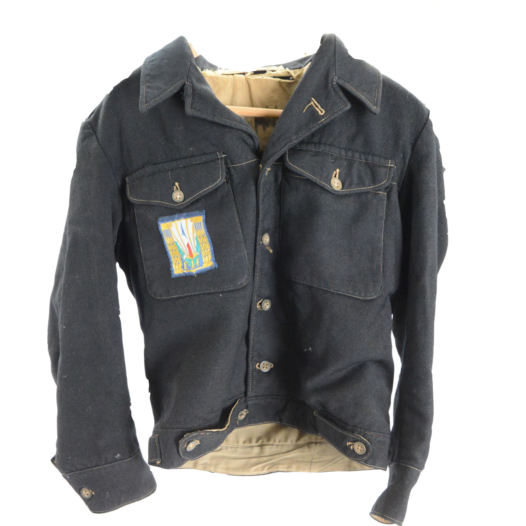 Chantiers de la Jeunesse Française (CJF) tunic, circa 1941-45, the black M44 tunic with CJF insignia to the right breast pocket, H62cm, W45cm 